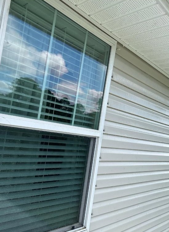 Clean siding and window area after wash