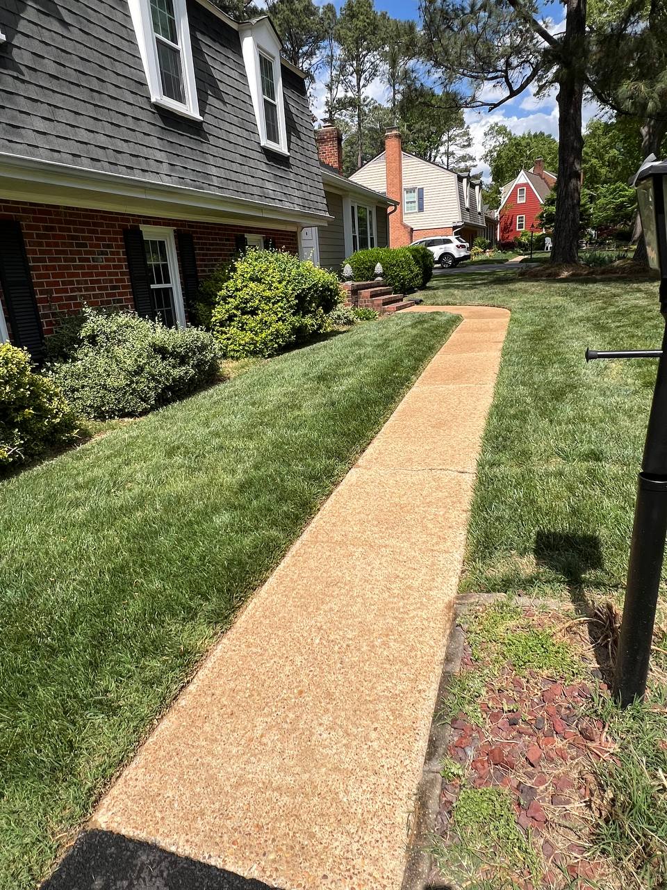 Clean sidewalk after pressure washing